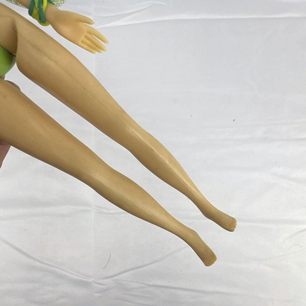 Disney Fairies Tinker Bell 9-inch articulated fashion doll with translucent glitter wings.
