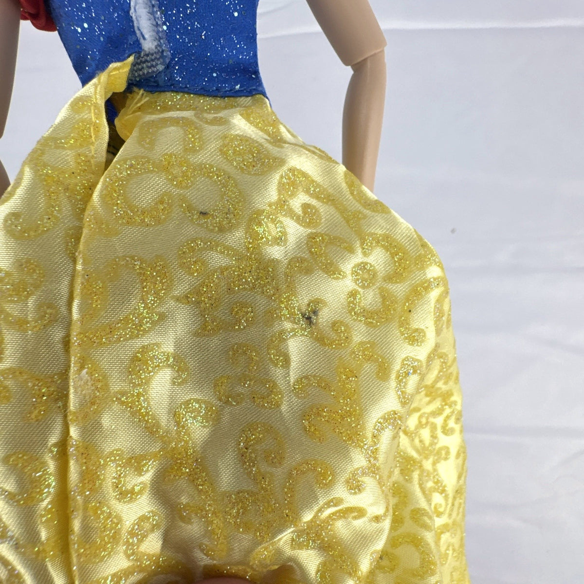 Disney Snow White 11-inch articulated fashion doll in yellow and blue glitter gown