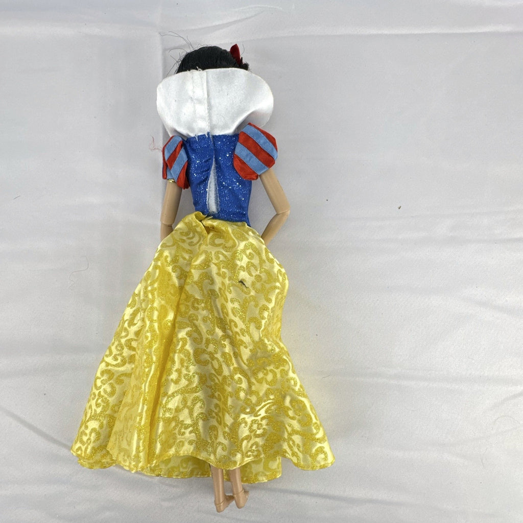 Disney Snow White 11-inch articulated fashion doll in yellow and blue glitter gown