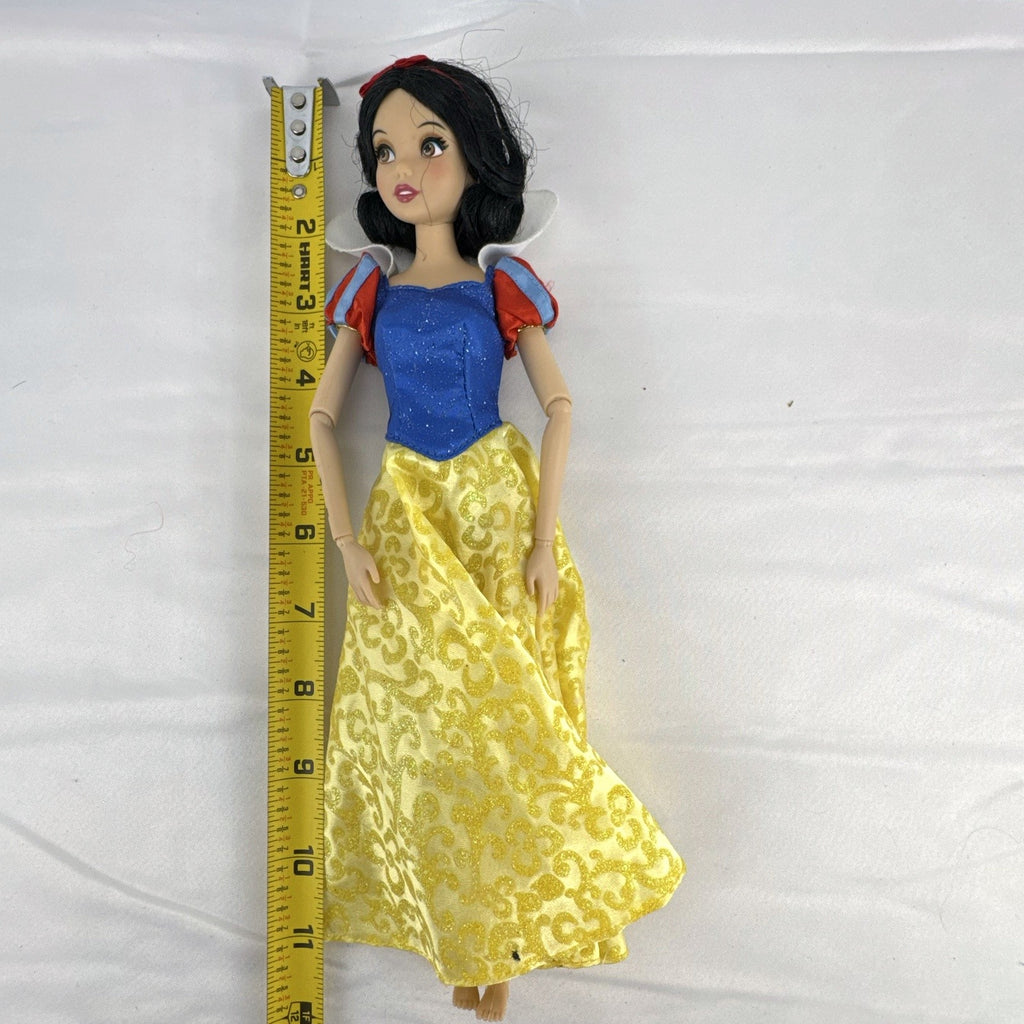 Disney Snow White 11-inch articulated fashion doll in yellow and blue glitter gown