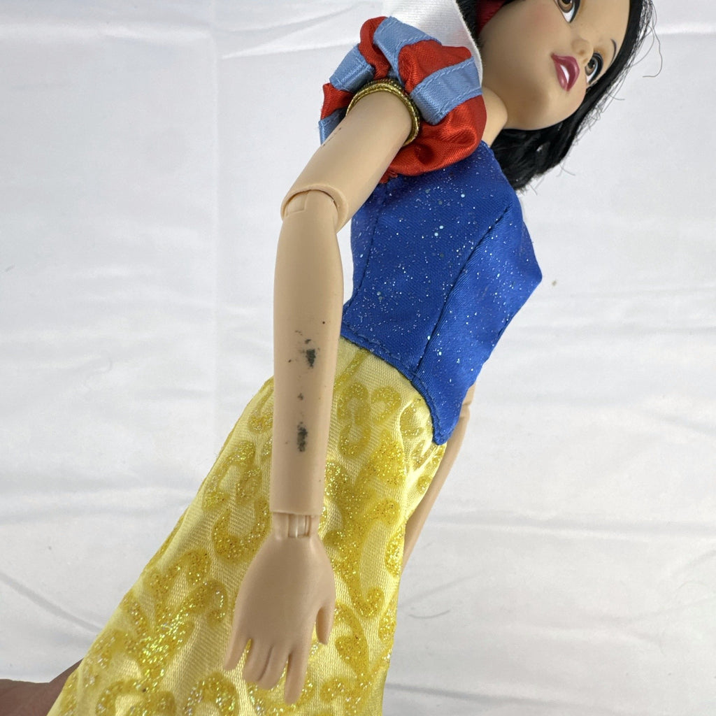 Disney Snow White 11-inch articulated fashion doll in yellow and blue glitter gown
