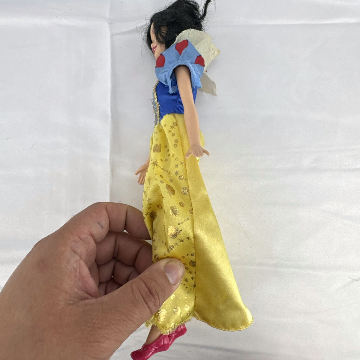 Mattel Disney Princess Snow White 11.5-inch doll wearing signature yellow sparkle gown and red shoes