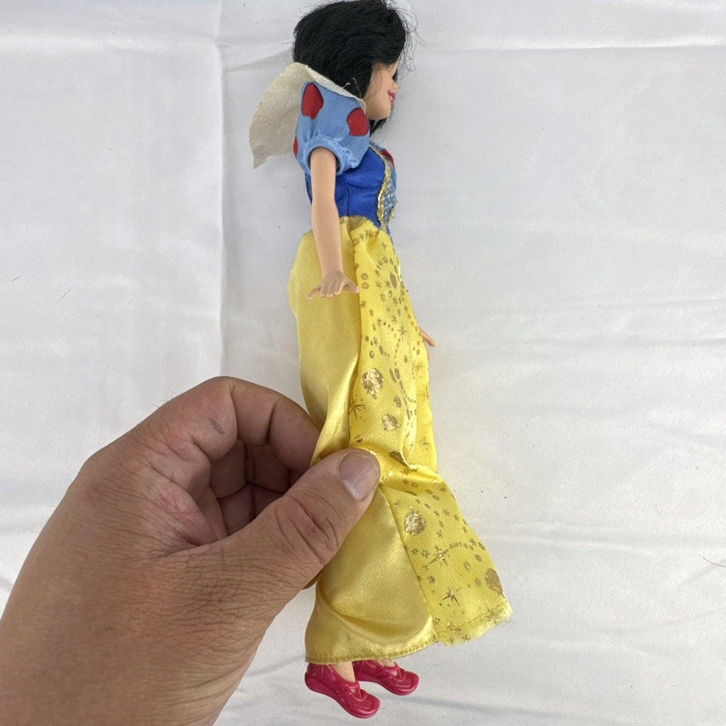 Mattel Disney Princess Snow White 11.5-inch doll wearing signature yellow sparkle gown and red shoes