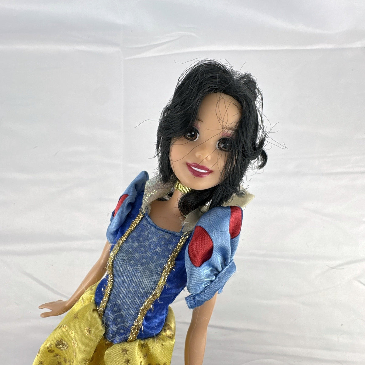 Mattel Disney Princess Snow White 11.5-inch doll wearing signature yellow sparkle gown and red shoes