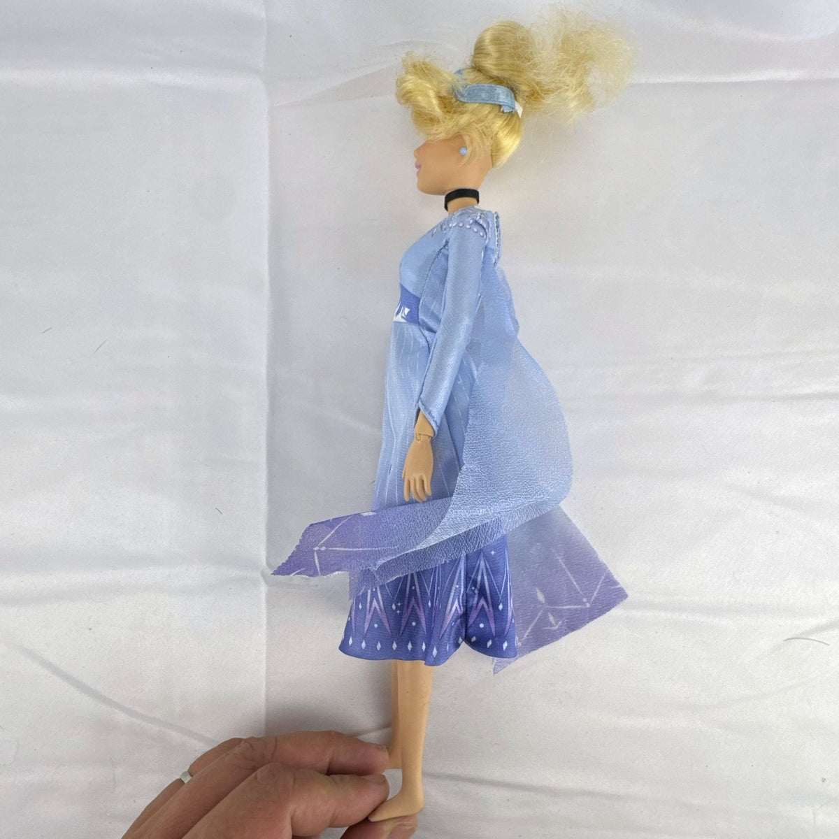 Disney Cinderella 11.5-inch articulated fashion doll wearing Frozen 2 Elsa blue travel dress