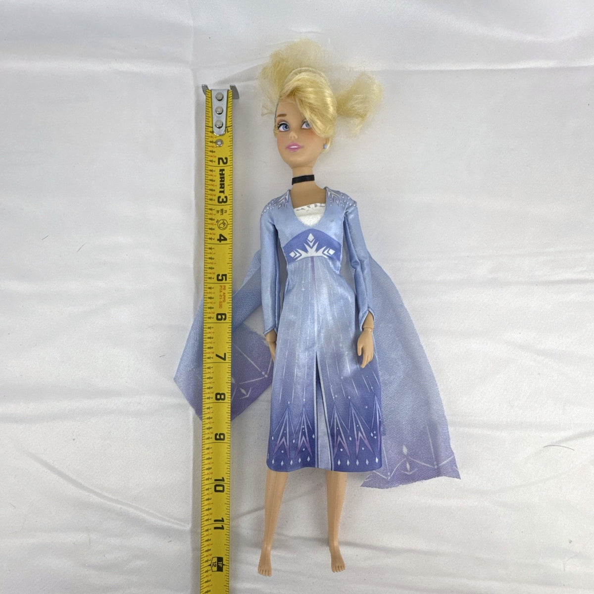 Disney Cinderella 11.5-inch articulated fashion doll wearing Frozen 2 Elsa blue travel dress
