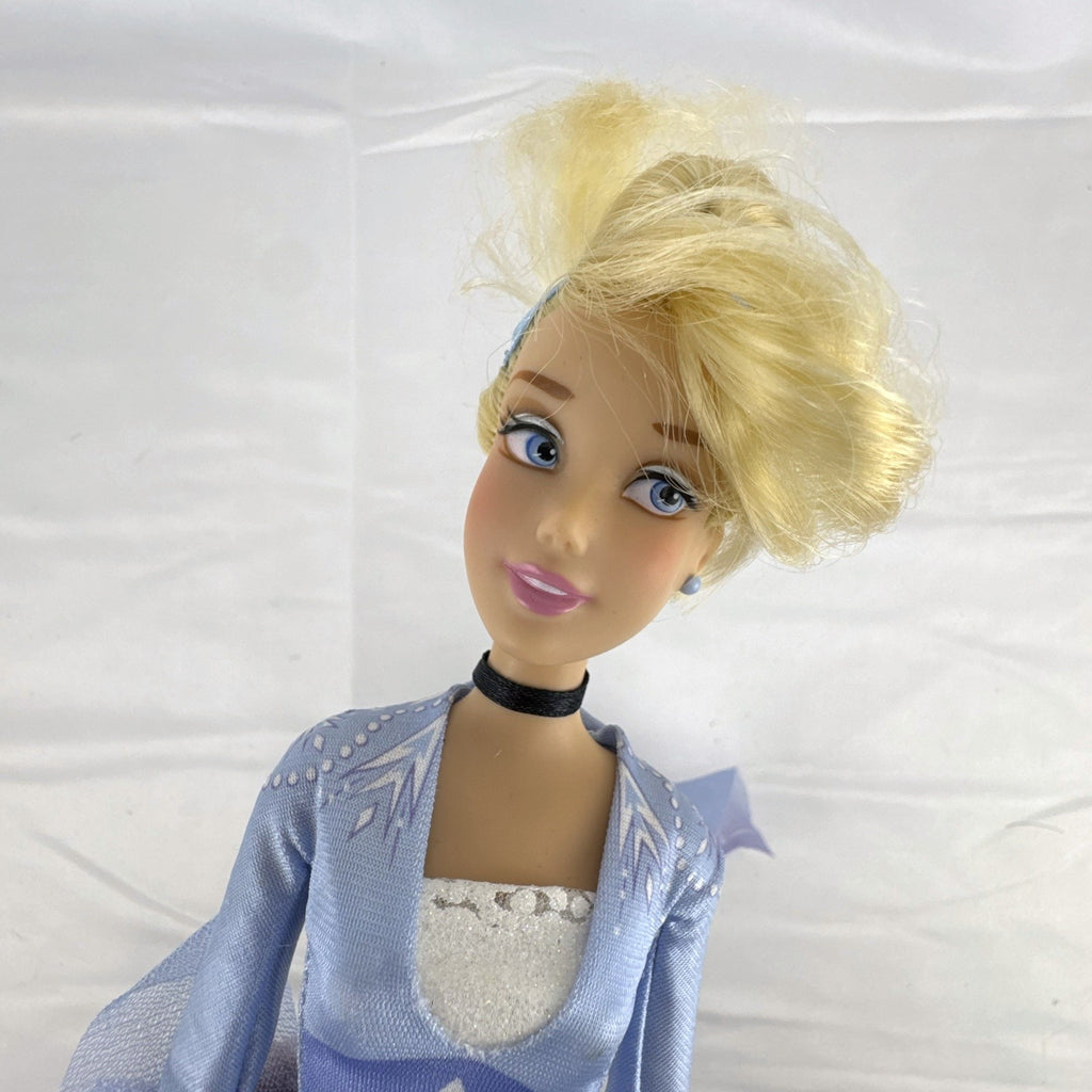 Disney Cinderella 11.5-inch articulated fashion doll wearing Frozen 2 Elsa blue travel dress
