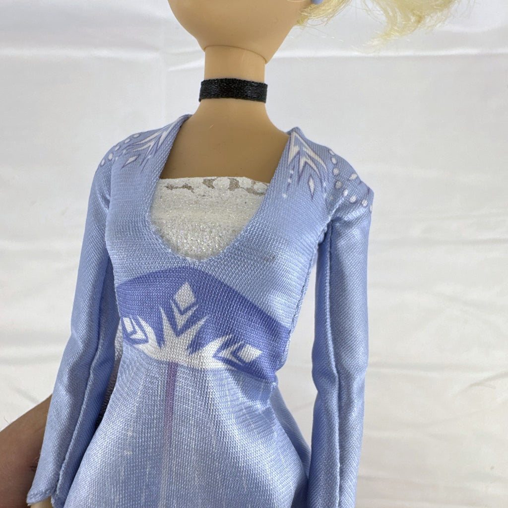 Disney Cinderella 11.5-inch articulated fashion doll wearing Frozen 2 Elsa blue travel dress