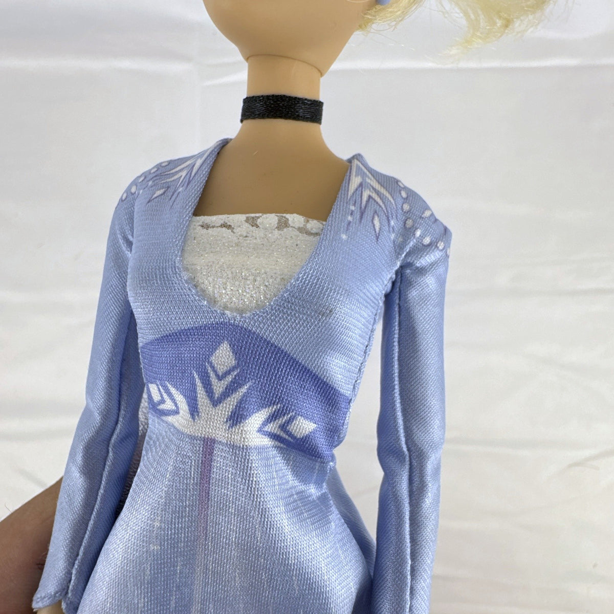 Disney Cinderella 11.5-inch articulated fashion doll wearing Frozen 2 Elsa blue travel dress
