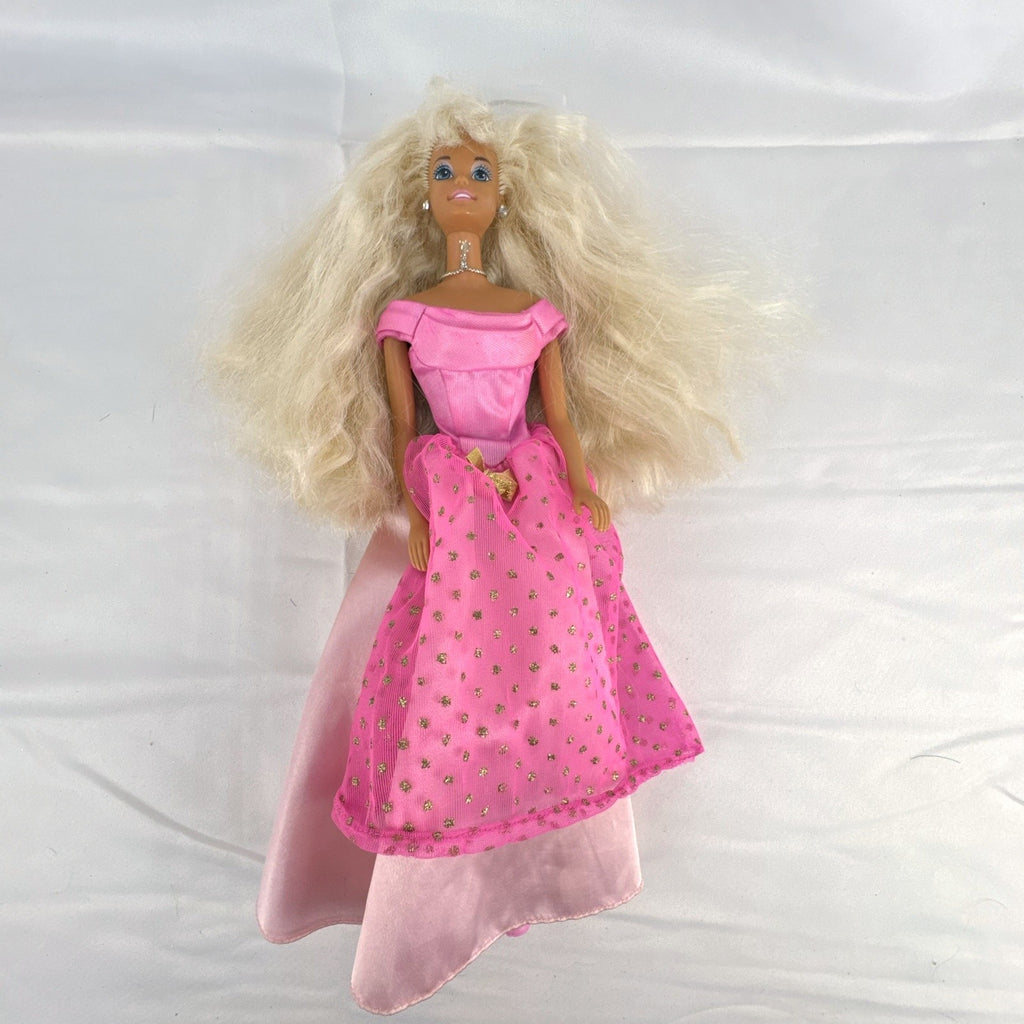 Vintage 1976 Mattel Superstar Barbie doll wearing a layered pink evening gown with jewelry