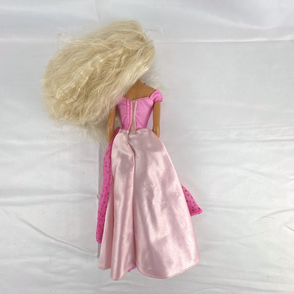 Vintage 1976 Mattel Superstar Barbie doll wearing a layered pink evening gown with jewelry