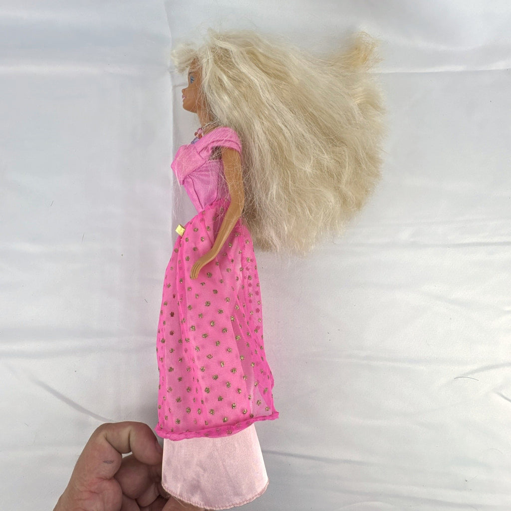 Vintage 1976 Mattel Superstar Barbie doll wearing a layered pink evening gown with jewelry