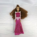 Disney Store 12-inch Belle fashion doll with brown hair wearing a pink and magenta glitter gown