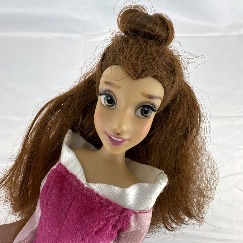 Disney Store 12-inch Belle fashion doll with brown hair wearing a pink and magenta glitter gown