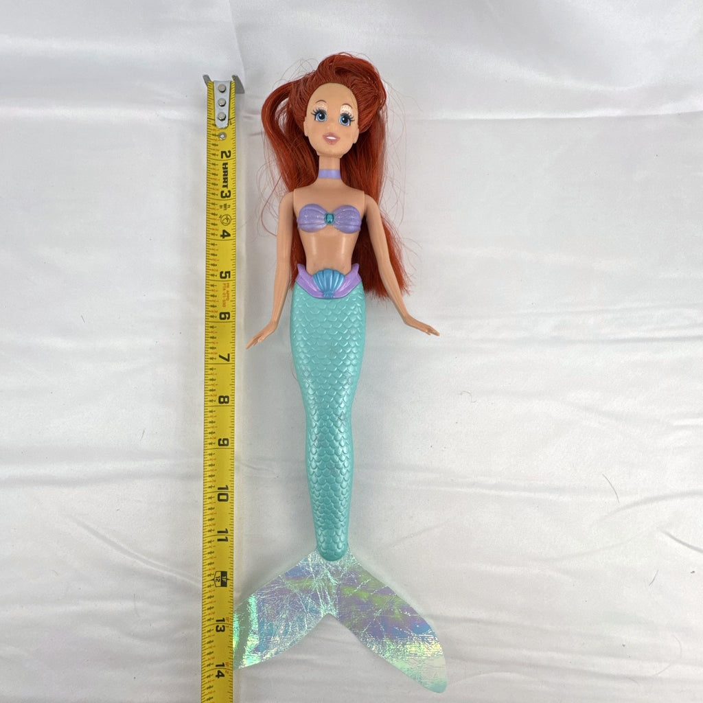 2005 Disney Princess 13-inch Ariel fashion doll with purple seashell bodice and iridescent turquoise tail fin