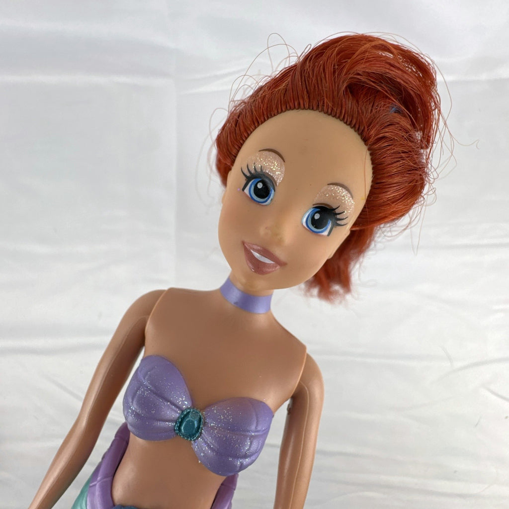 2005 Disney Princess 13-inch Ariel fashion doll with purple seashell bodice and iridescent turquoise tail fin