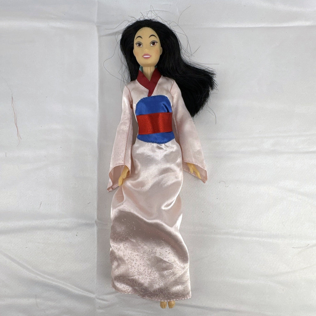 Vintage 12-inch Disney Mulan fashion doll wearing a pink satin matchmaker gown with red and blue sash
