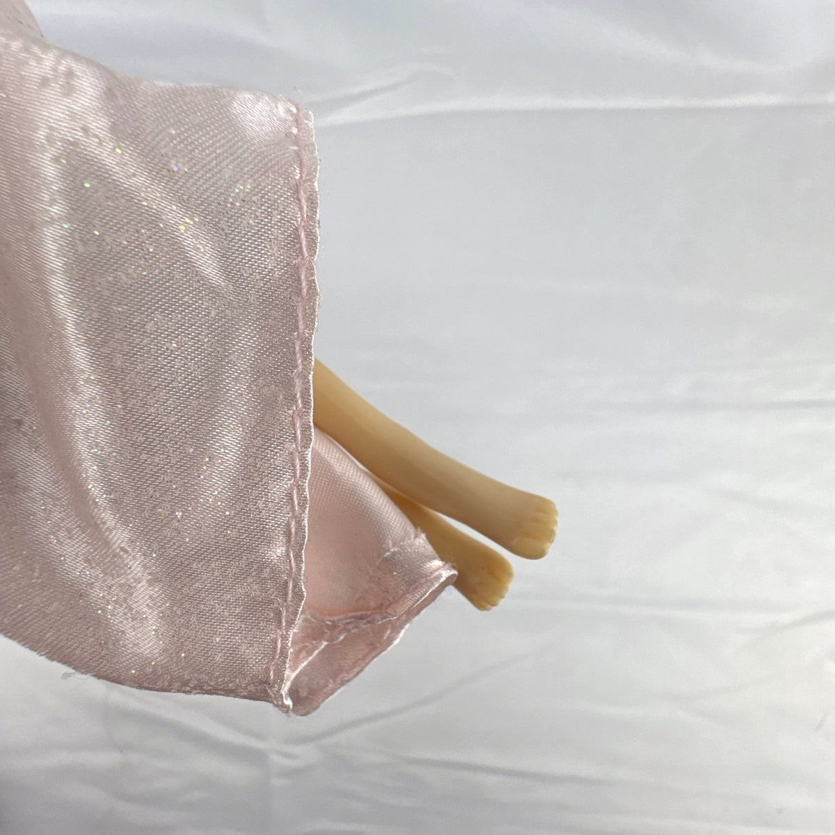 Vintage 12-inch Disney Mulan fashion doll wearing a pink satin matchmaker gown with red and blue sash