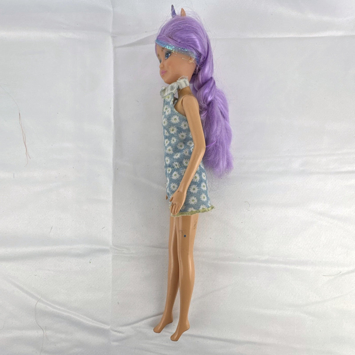 ZURU Sparkle Girlz 10.5-inch unicorn princess doll with purple tinsel hair wearing a blue daisy romper