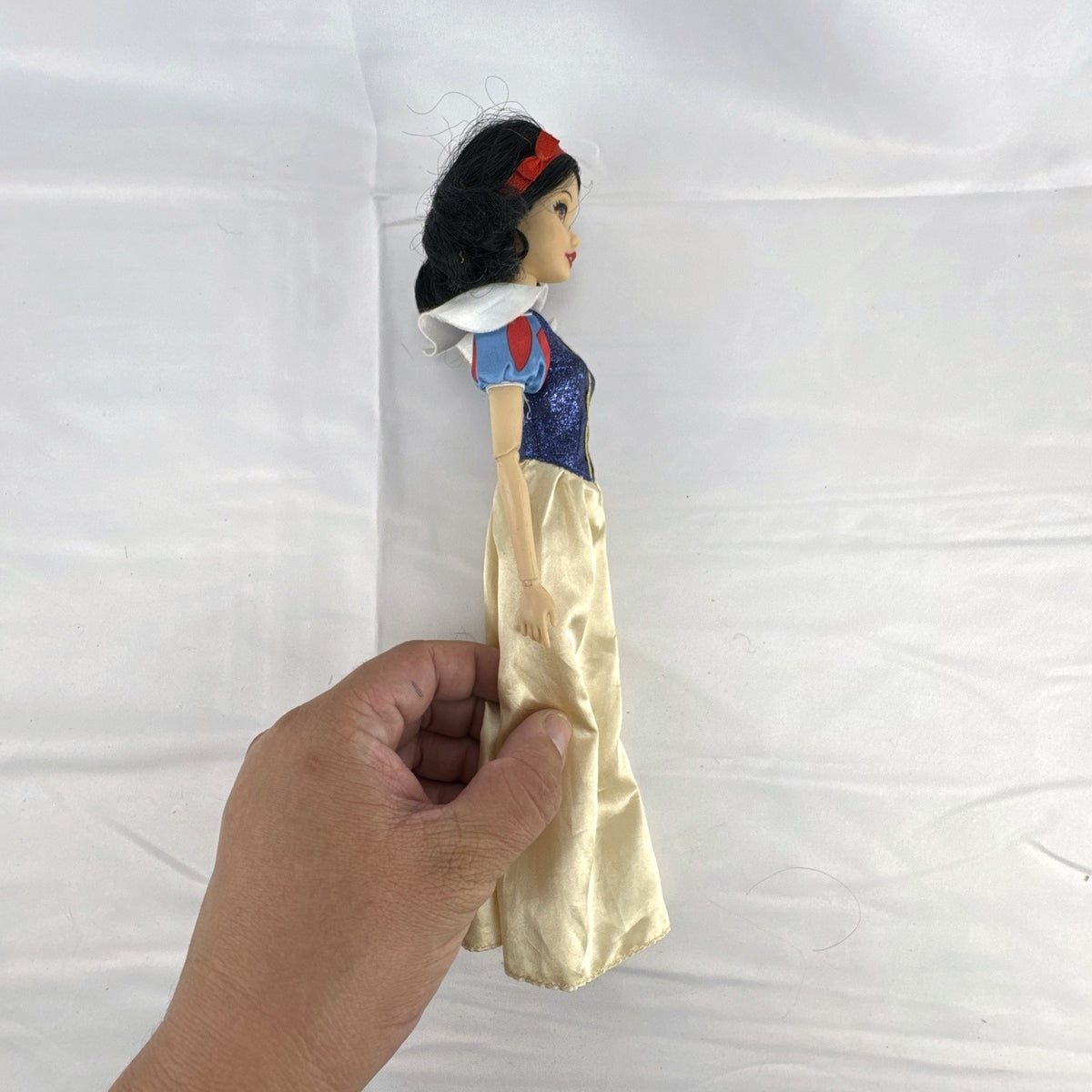 Disney Store Snow White 11.5-inch fashion doll in classic blue and yellow gown with articulated arms