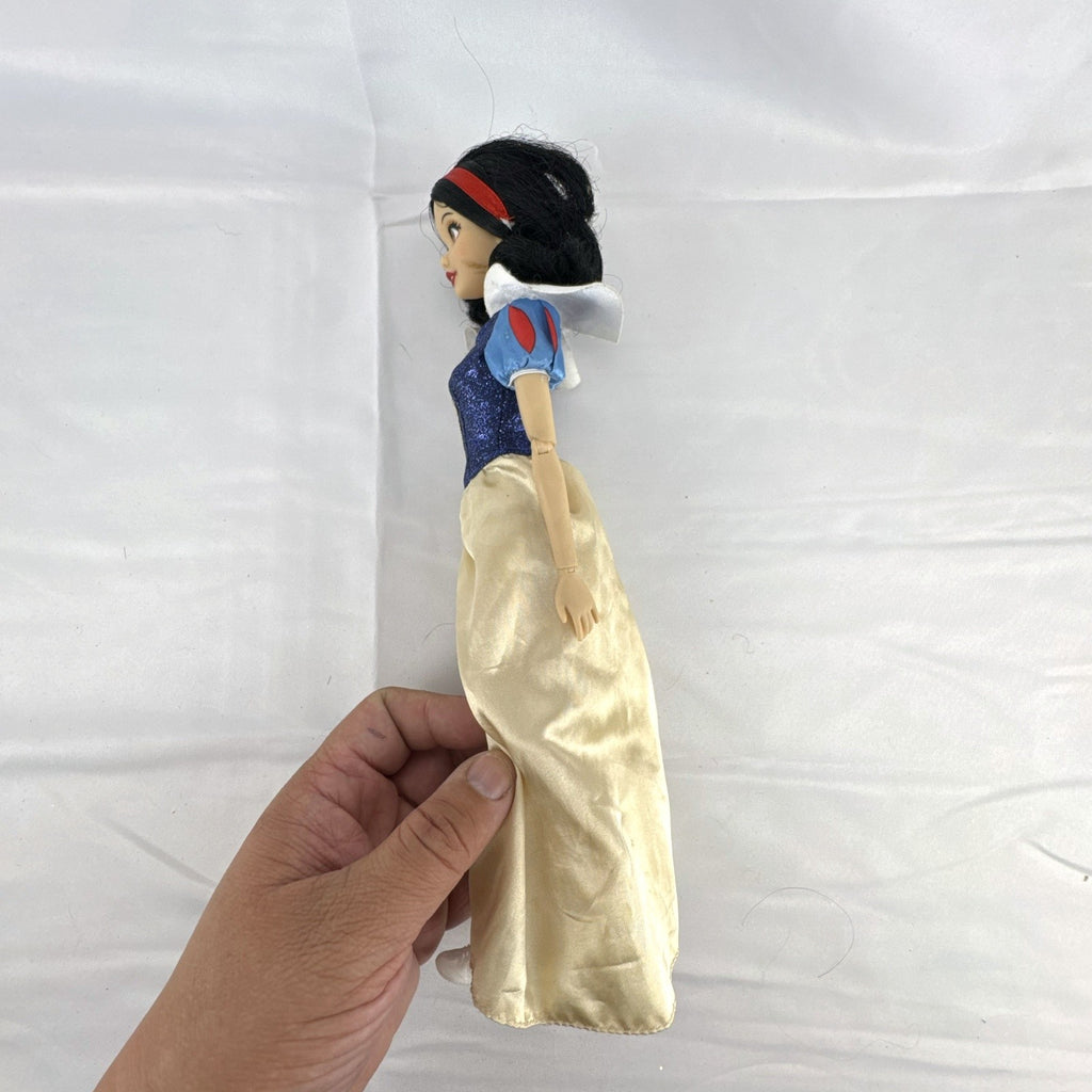 Disney Store Snow White 11.5-inch fashion doll in classic blue and yellow gown with articulated arms