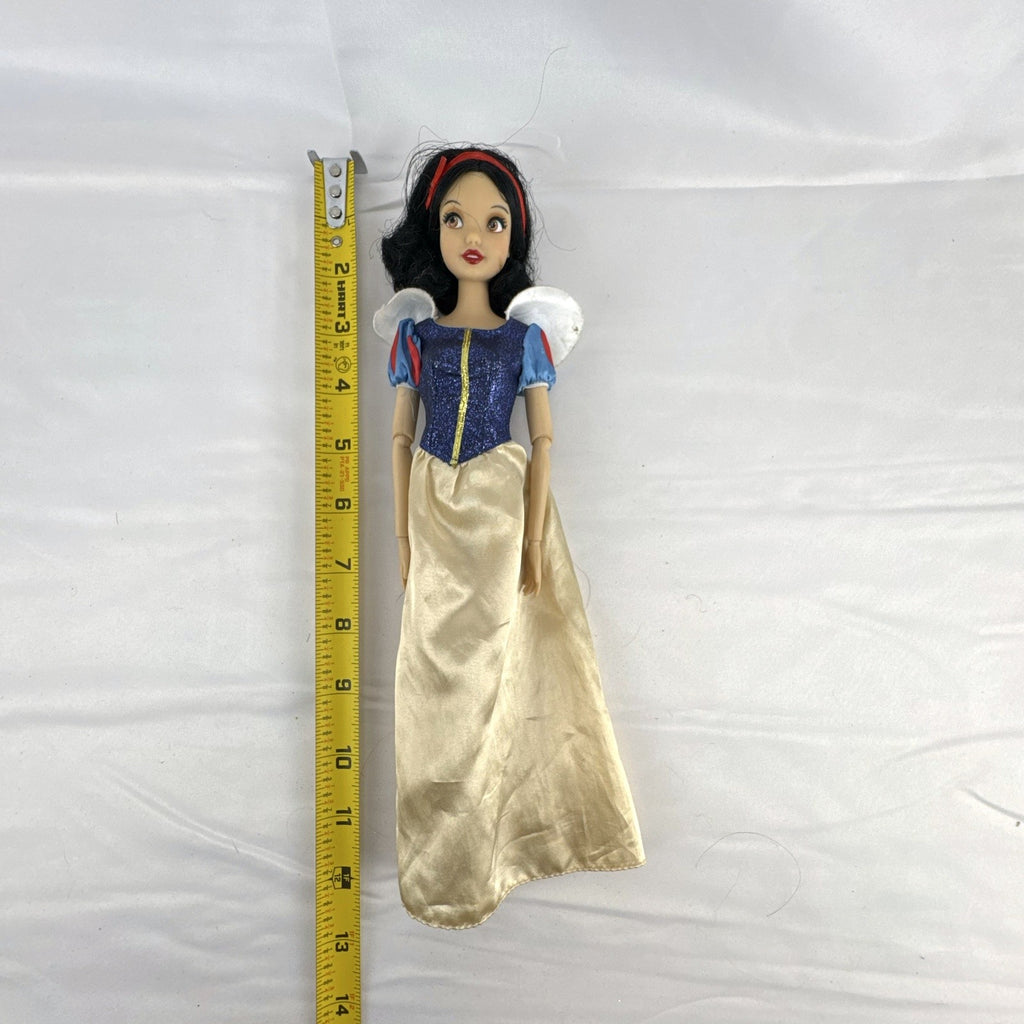 Disney Store Snow White 11.5-inch fashion doll in classic blue and yellow gown with articulated arms