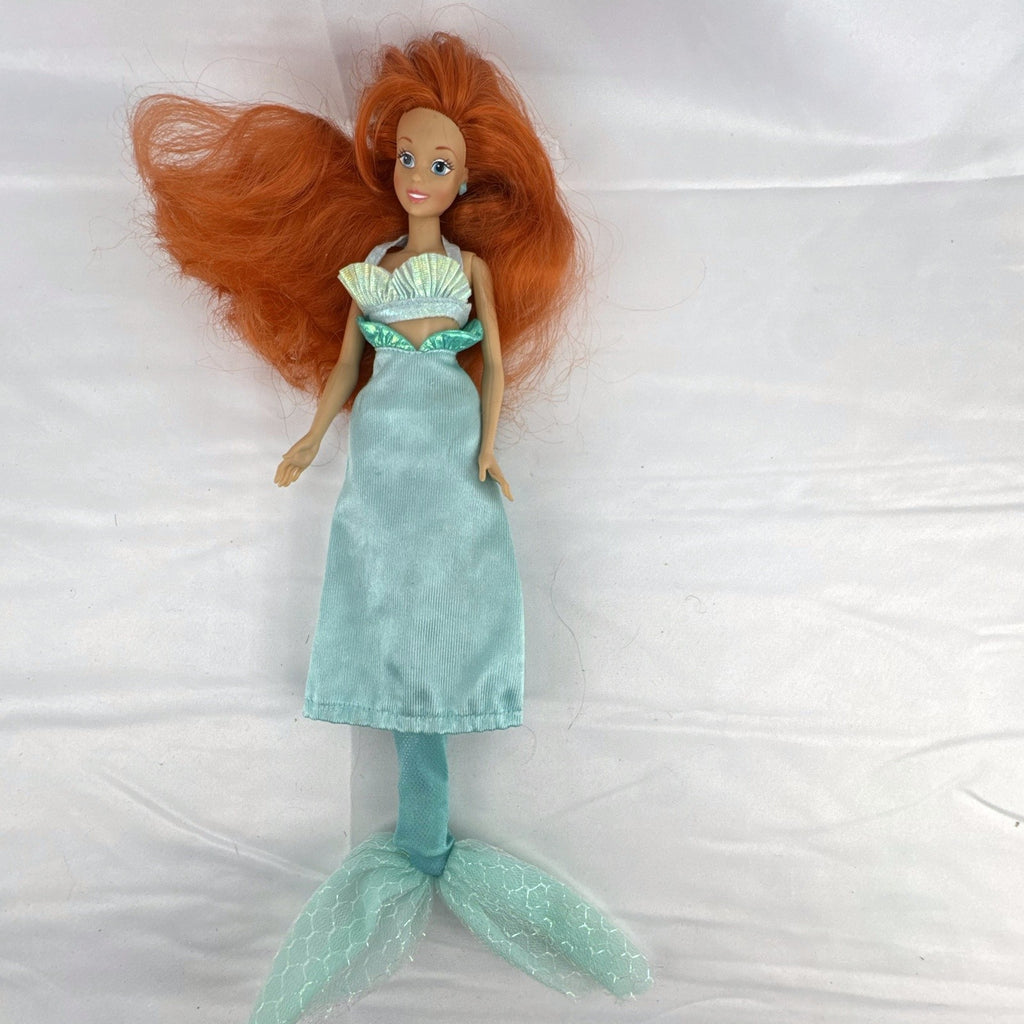 Vintage 1990s Tyco Disney The Little Mermaid Ariel 14-inch doll with red hair and iridescent mermaid tail outfit