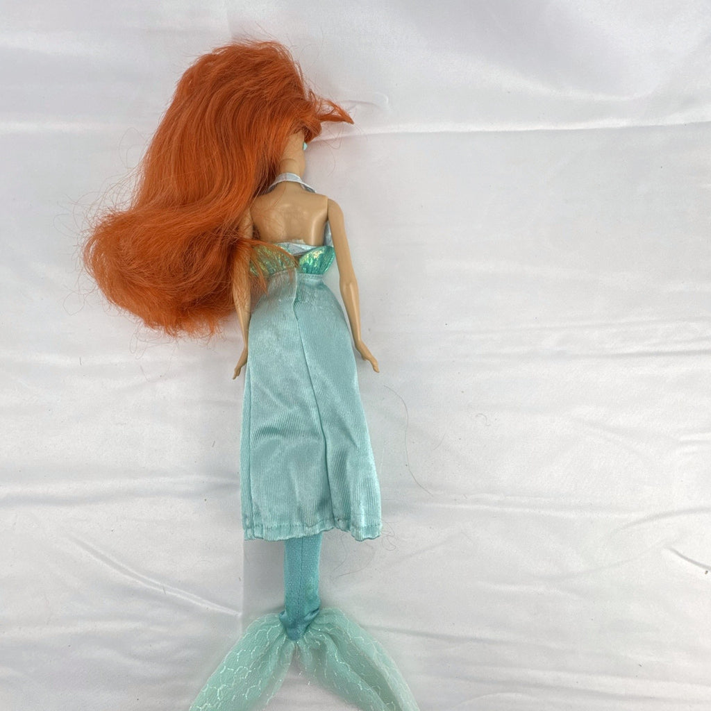 Vintage 1990s Tyco Disney The Little Mermaid Ariel 14-inch doll with red hair and iridescent mermaid tail outfit