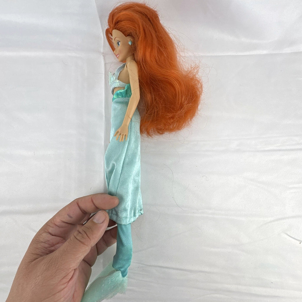 Vintage 1990s Tyco Disney The Little Mermaid Ariel 14-inch doll with red hair and iridescent mermaid tail outfit
