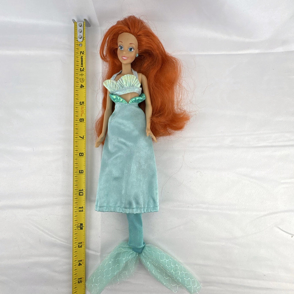 Vintage 1990s Tyco Disney The Little Mermaid Ariel 14-inch doll with red hair and iridescent mermaid tail outfit