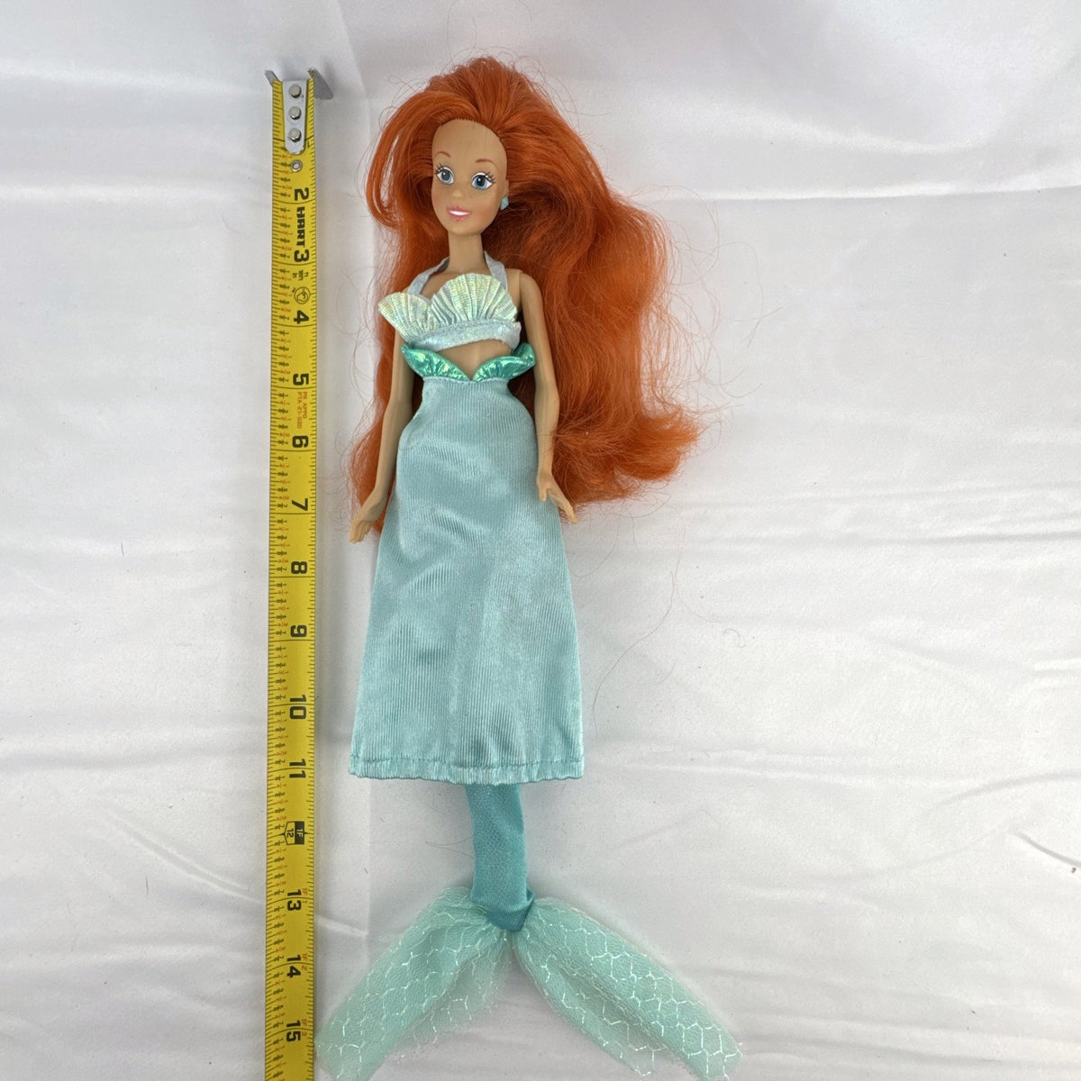 Vintage 1990s Tyco Disney The Little Mermaid Ariel 14-inch doll with red hair and iridescent mermaid tail outfit