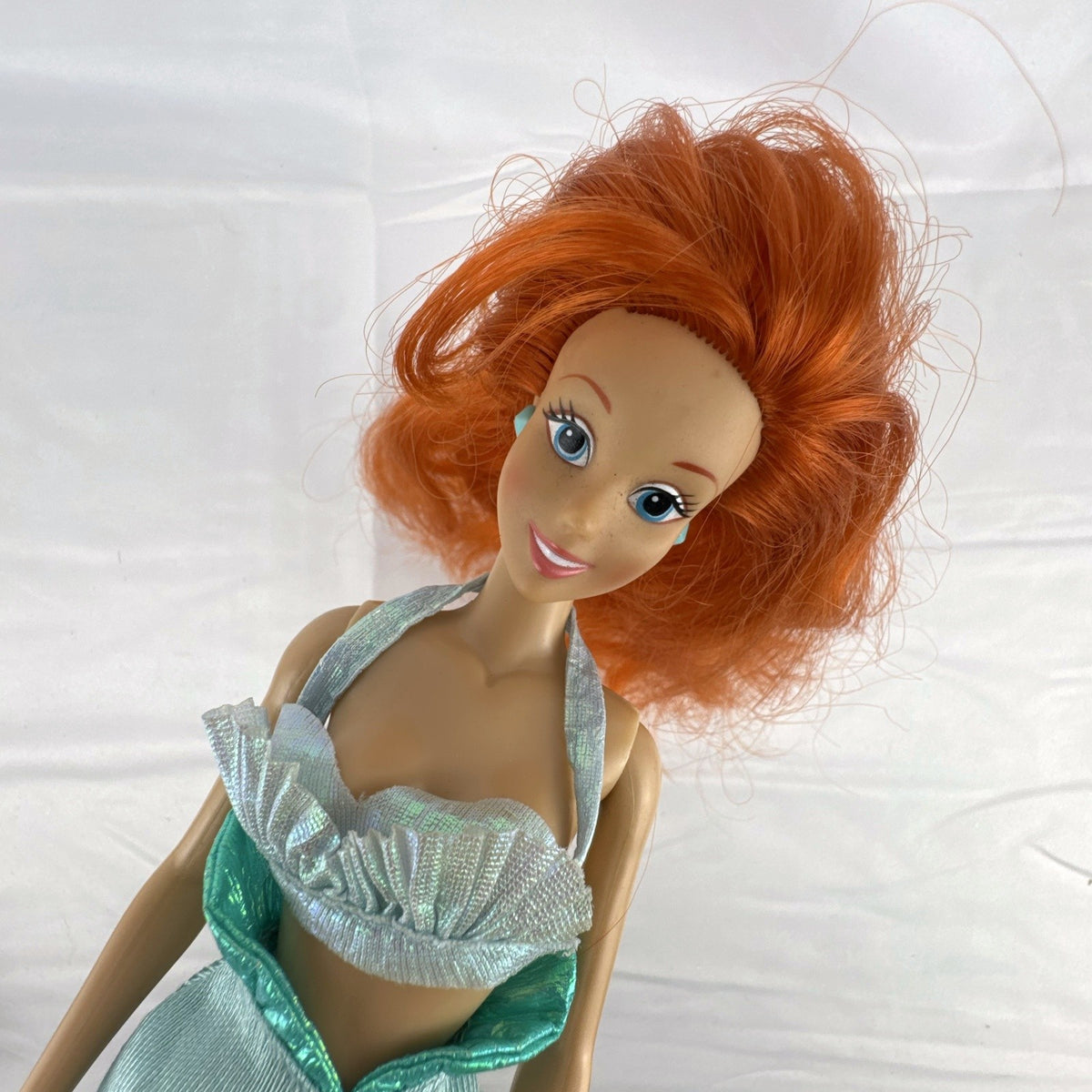 Vintage 1990s Tyco Disney The Little Mermaid Ariel 14-inch doll with red hair and iridescent mermaid tail outfit