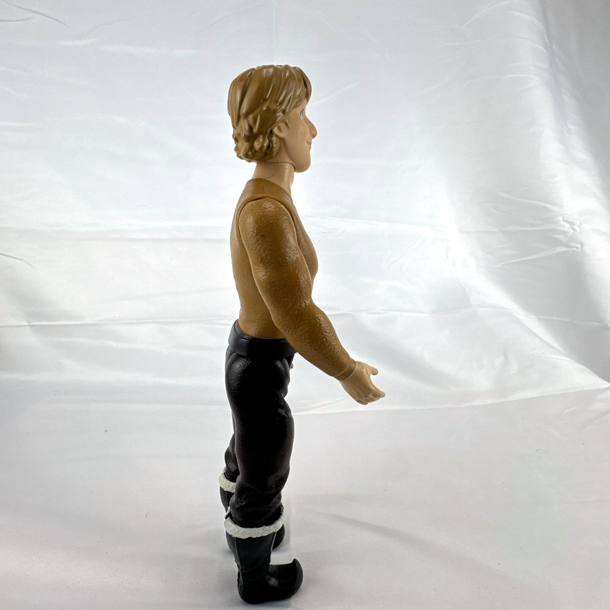 Hasbro Disney Frozen 11-inch Kristoff male fashion doll featuring molded outfit and articulated joints.
