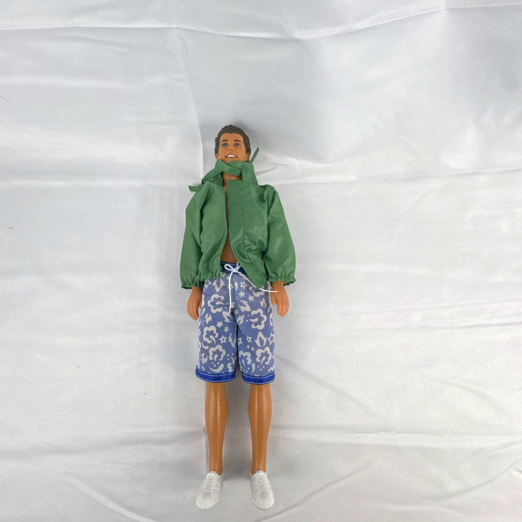 Mattel 12-inch Ken doll with molded brown hair wearing green jacket and blue swim board shorts