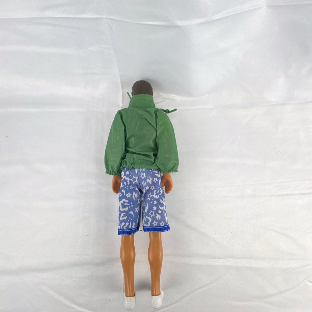 Mattel 12-inch Ken doll with molded brown hair wearing green jacket and blue swim board shorts