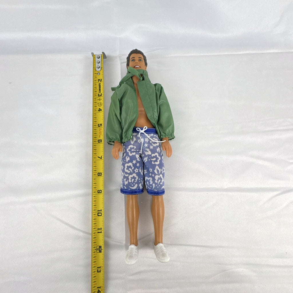 Mattel 12-inch Ken doll with molded brown hair wearing green jacket and blue swim board shorts