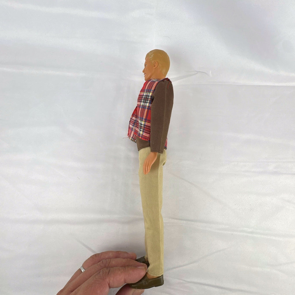 Vintage 1991 Mattel Ken doll with molded blonde hair wearing a red plaid vest outfit and brown shoes