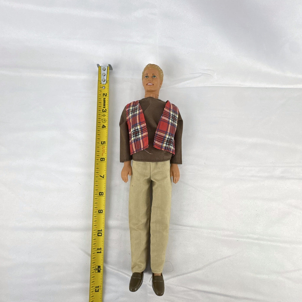 Vintage 1991 Mattel Ken doll with molded blonde hair wearing a red plaid vest outfit and brown shoes