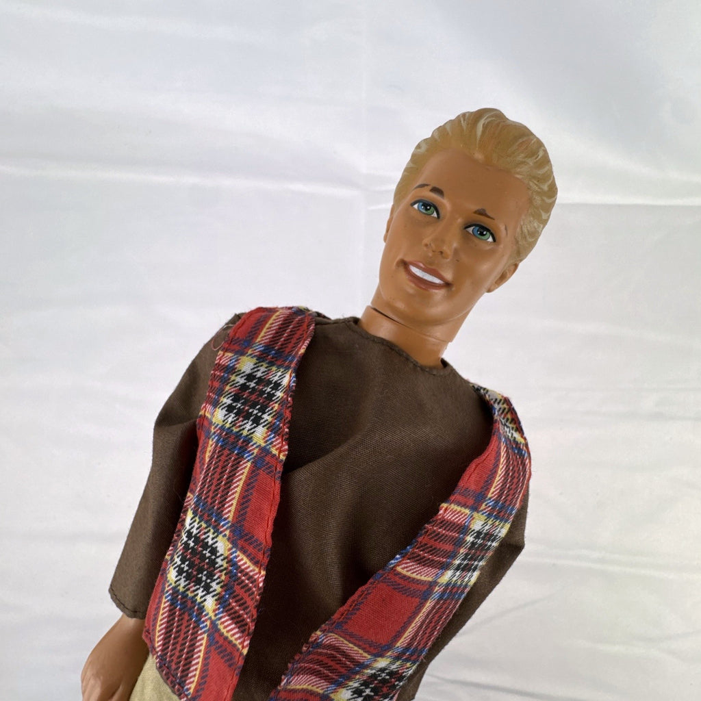 Vintage 1991 Mattel Ken doll with molded blonde hair wearing a red plaid vest outfit and brown shoes
