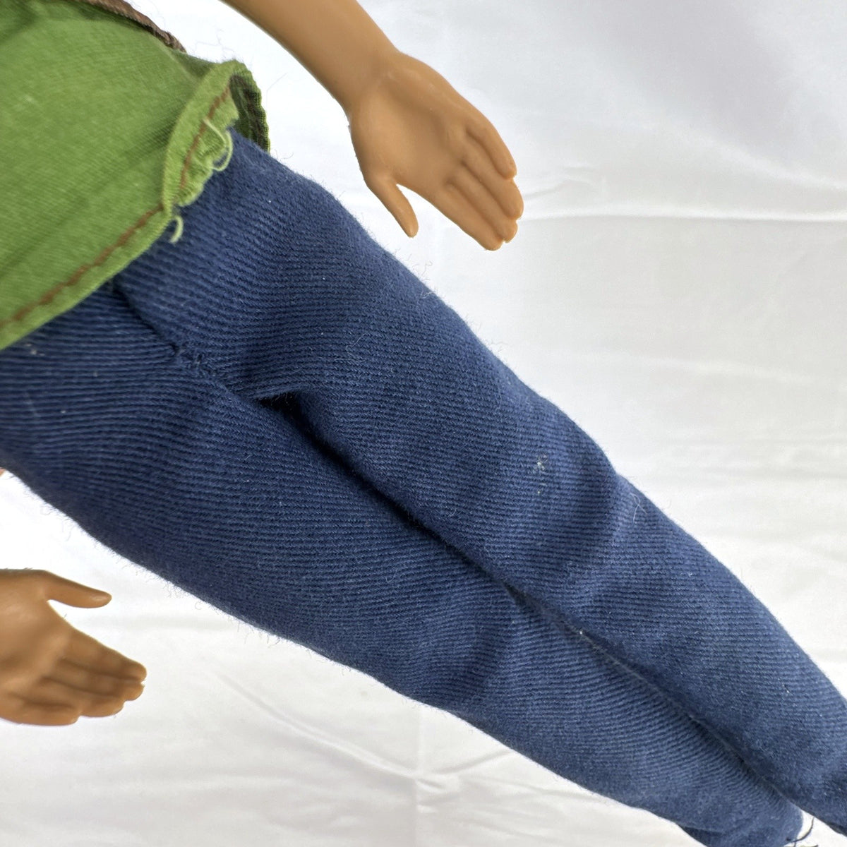 Mattel 2009 Ken 12-inch fashion doll with rooted blonde hair wearing a layered jacket and denim pants