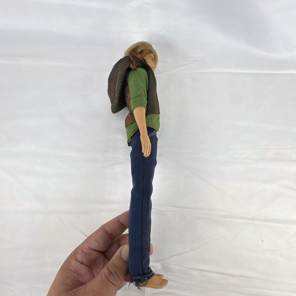 Mattel 2009 Ken 12-inch fashion doll with rooted blonde hair wearing a layered jacket and denim pants