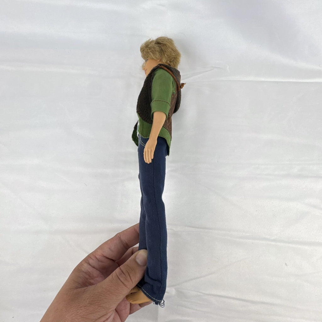 Mattel 2009 Ken 12-inch fashion doll with rooted blonde hair wearing a layered jacket and denim pants