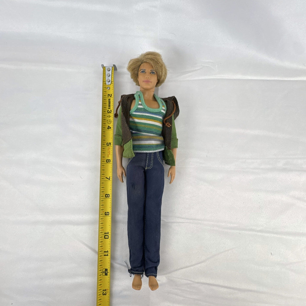 Mattel 2009 Ken 12-inch fashion doll with rooted blonde hair wearing a layered jacket and denim pants