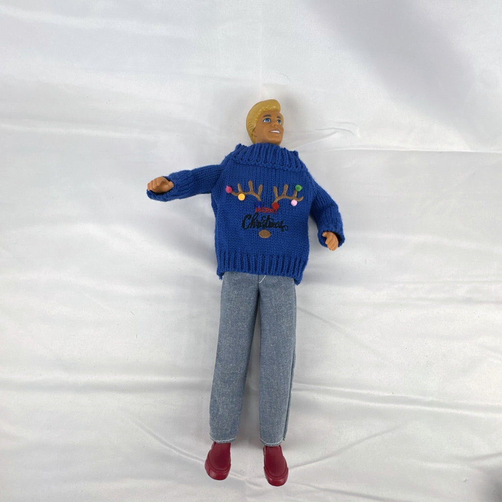 Vintage Mattel Ken doll in blue knit reindeer Christmas sweater, gray pants, and red shoes
