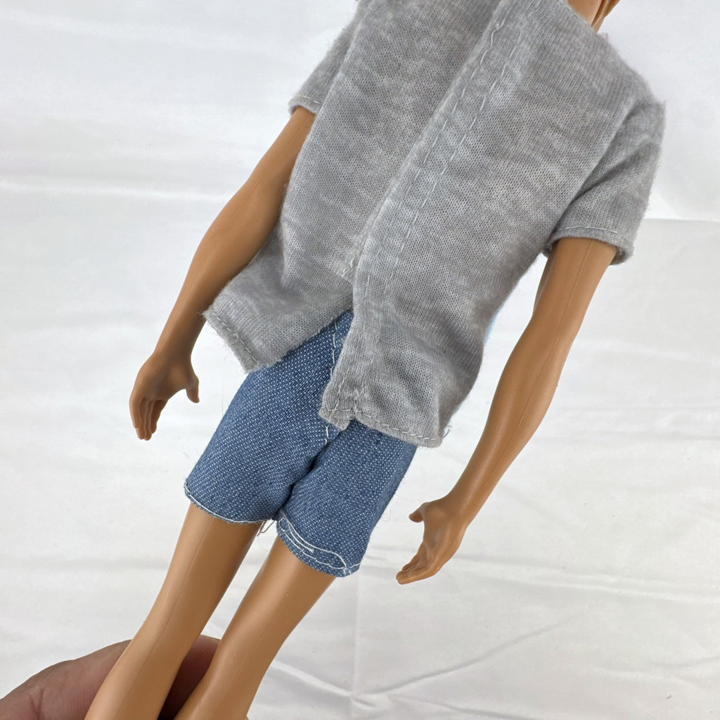 Mattel Ken 12-inch slim fashion doll wearing a colorblock pocket t-shirt and denim shorts