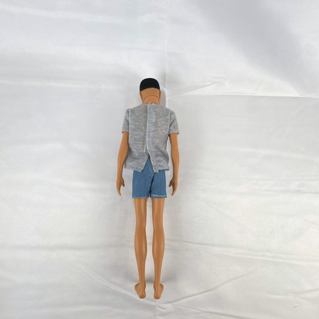 Mattel Ken 12-inch slim fashion doll wearing a colorblock pocket t-shirt and denim shorts