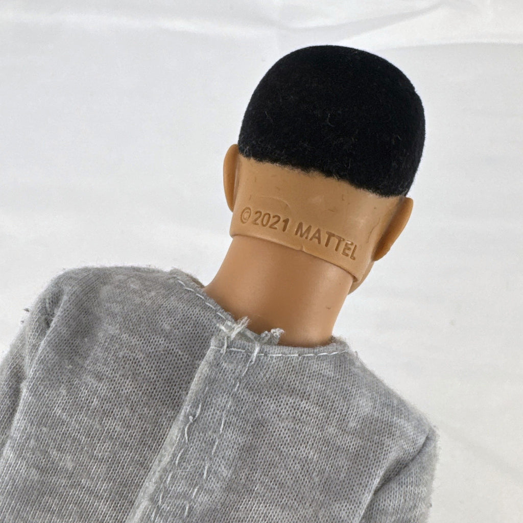 Mattel Ken 12-inch slim fashion doll wearing a colorblock pocket t-shirt and denim shorts