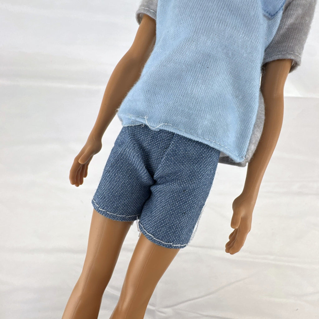 Mattel Ken 12-inch slim fashion doll wearing a colorblock pocket t-shirt and denim shorts