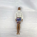 Mattel Barbie Fashionistas 12-inch Ken doll with molded cornrows wearing white mock neck top and palm tree shorts