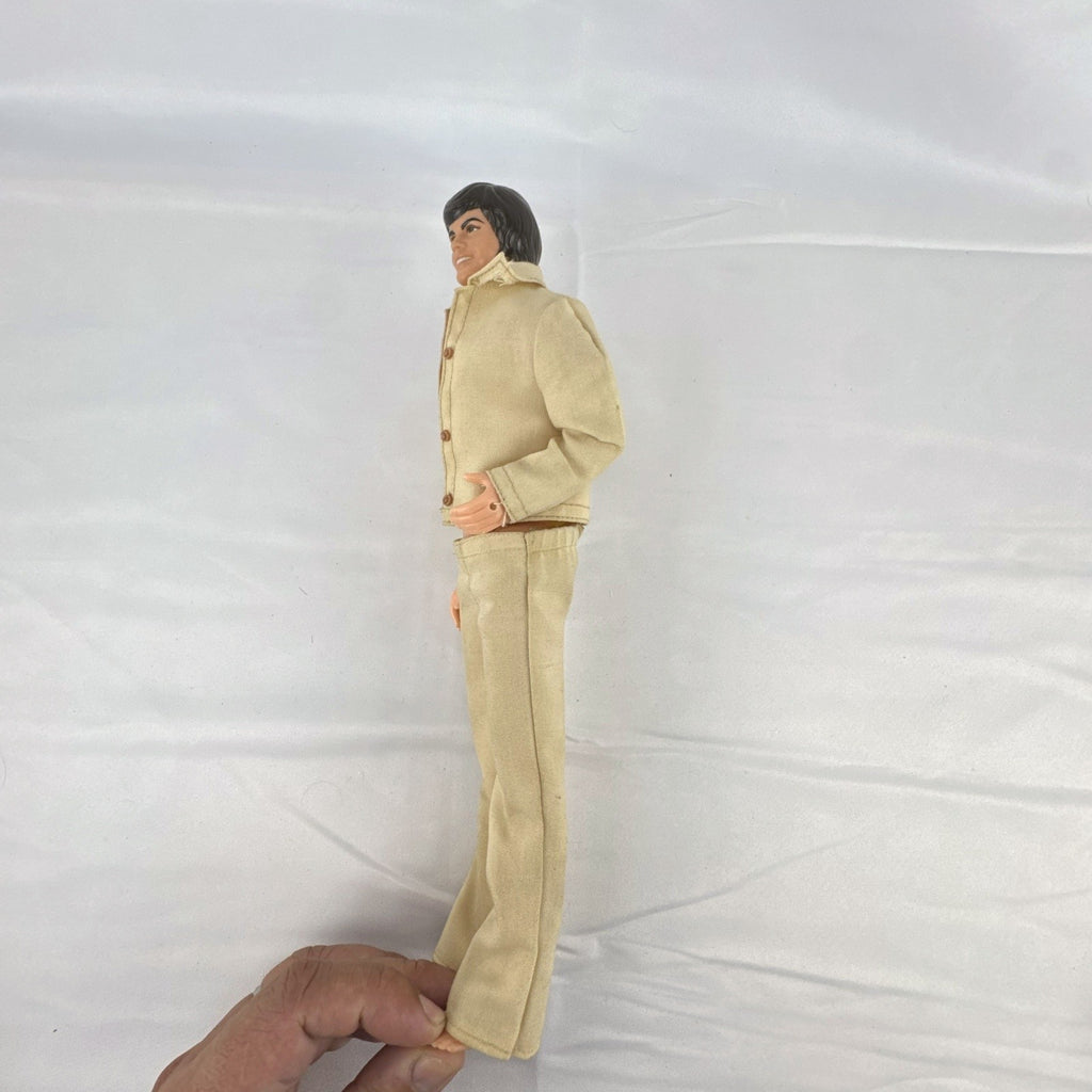 Vintage 1976 Mattel Donny Osmond 12-inch fashion doll wearing two-piece tan leisure suit